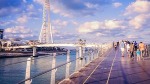 People walk towards Bluewaters Island, one of the developments in Dubai Residential REIT's $5.7bn portfolio