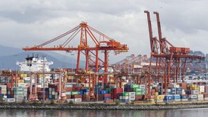 Gantry cranes and shipping containers on Vancouver's downtown waterfront. The Port of Vancouver facility is operated by DP World