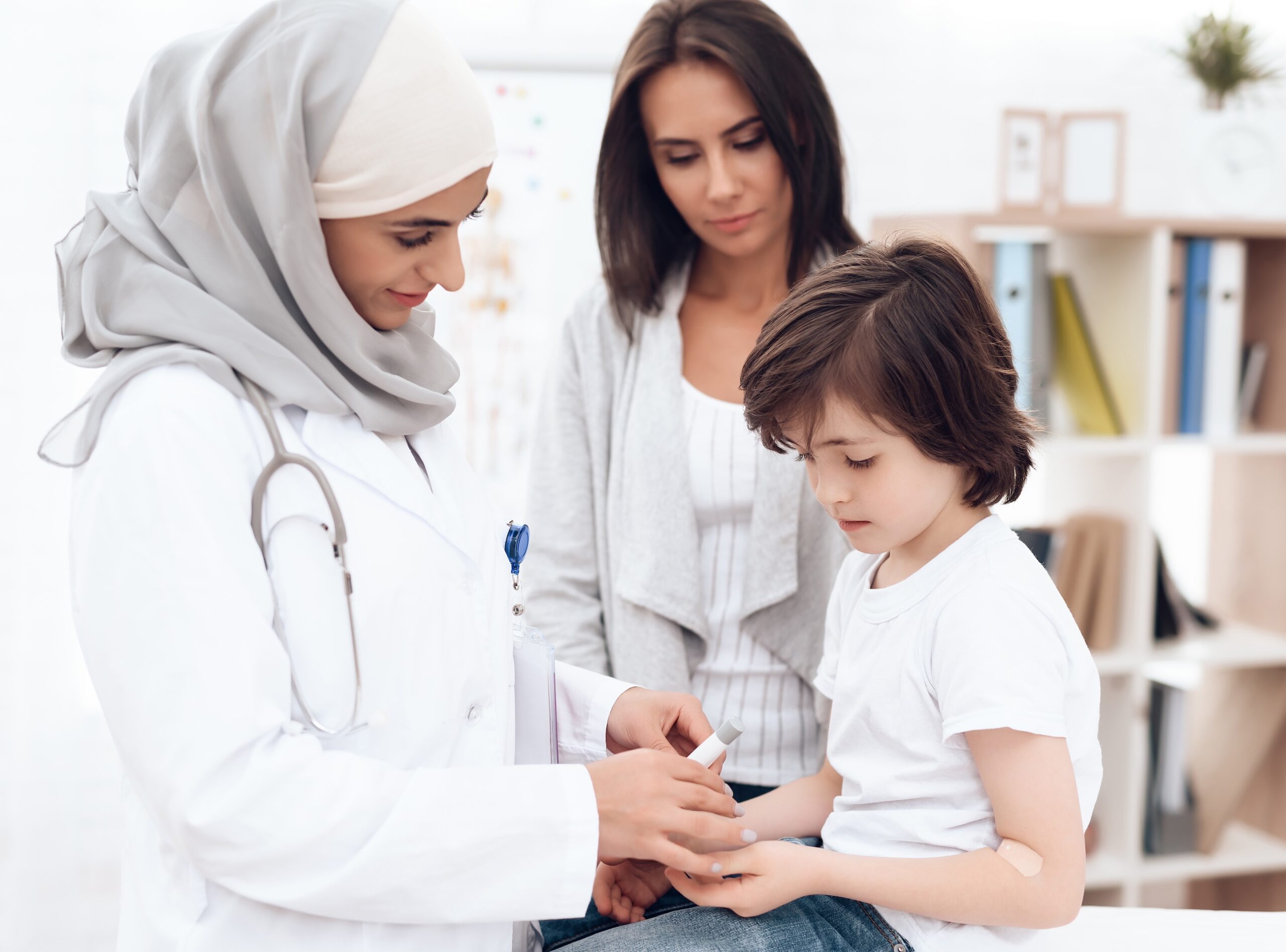 A doctor examines a sick child. Healthcare spending in Saudi Arabia will rise by nearly 9% a year up to 2029, according to Alpen Capital