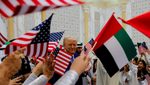 President Donald Trump is greeted by children waving flags at Qasr Al Watan in Abu Dhabi. The US-UAE partnership on AI stands out among the deals signed during his trip