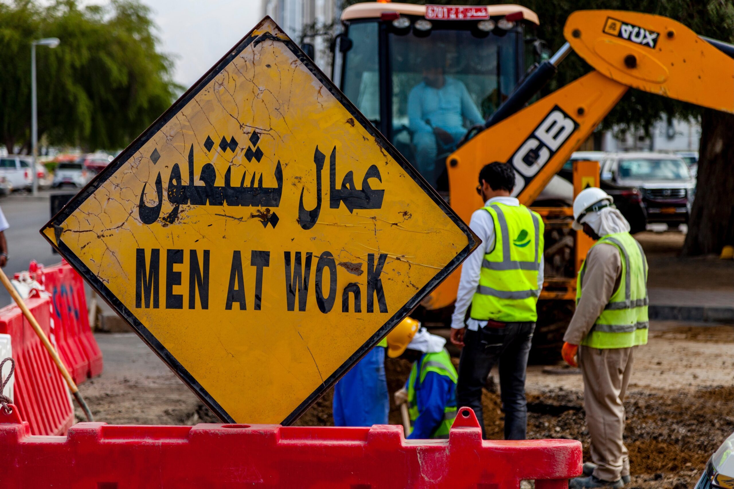 Migrant workers repairing a road in Muscat, Oman. Unemployment among Omanis under 24 was at 14% in 2023, with the majority being women