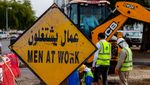 Migrant workers repairing a road in Muscat, Oman. Unemployment among Omanis under 24 was at 14% in 2023, with the majority being women
