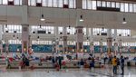 Fishmongers and shoppers at Kuwait City's fish market. The Circle app offers grocery delivery around Kuwait