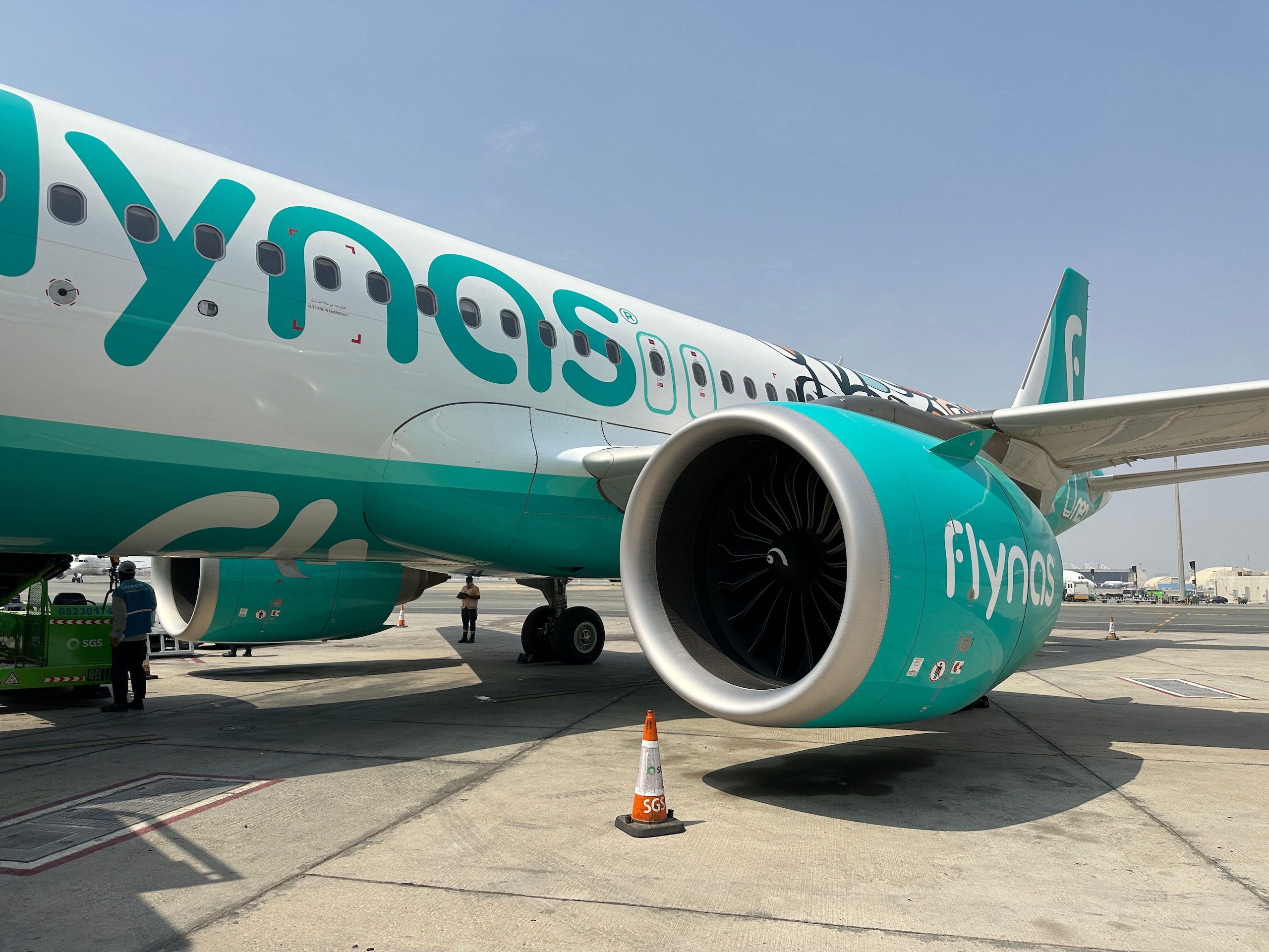 Workers inspect a Flynas jet on the tarmac in Riyadh. The IPO could value Flynas at up to $3.7bn