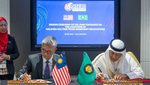 Malaysia’s minister of investment, trade and industry Tengku Zafrul Aziz and GCC secretary general Jasem Mohamed Albudaiwi sign the statement to start official FTA talks
