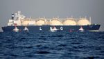 A liquefied natural gas tanker is tugged towards a thermal power station in Futtsu, east of Tokyo, Japan