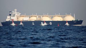 A liquefied natural gas tanker is tugged towards a thermal power station in Futtsu, east of Tokyo, Japan