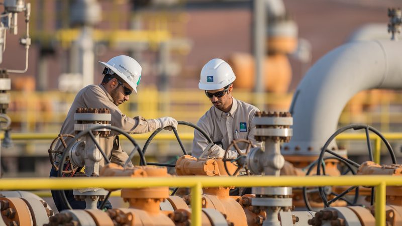 Operators at a Saudi Aramco facility. Impacted by lower oil revenues, Aramco's first quarter profits suffered a significant drop