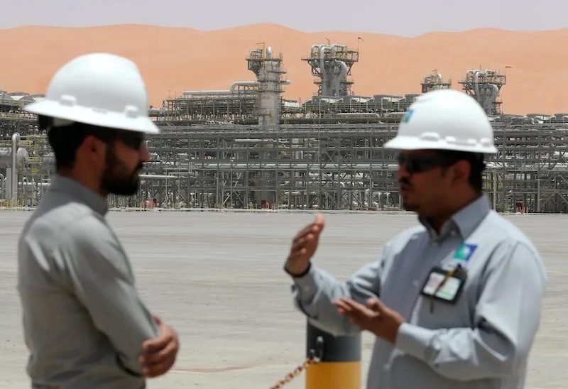 Saudi Aramco employees on site. The company has asked investment bankers to pitch ideas for how to raise funds from its assets