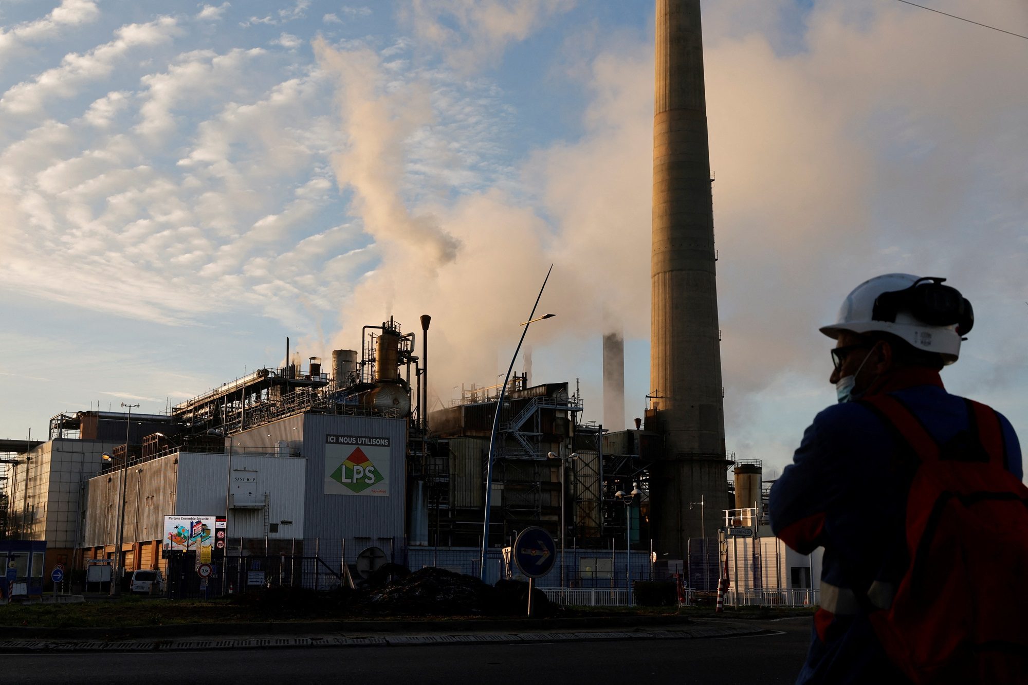 A worker at an ExxonMobil oil refinery. The company has maintained its capex guidance and will work with Adnoc