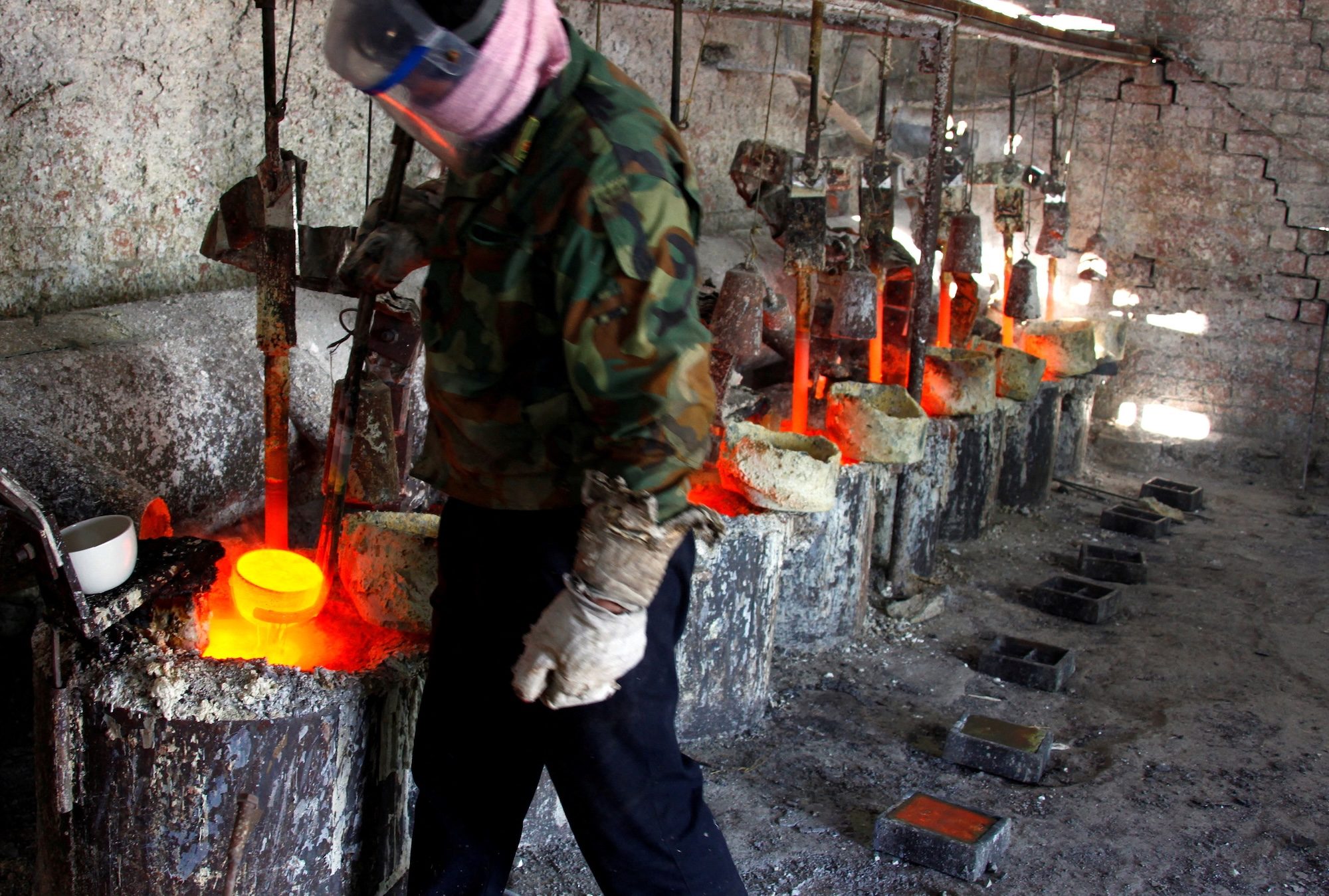 A worker at a smelting workshop pours the rare earth metal lanthanum into a mould. Turkey has deposits of lanthanum, cerium and neodymium