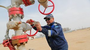 An oil worker in Kazakhstan, which has been exceeding its Opec+ quotas