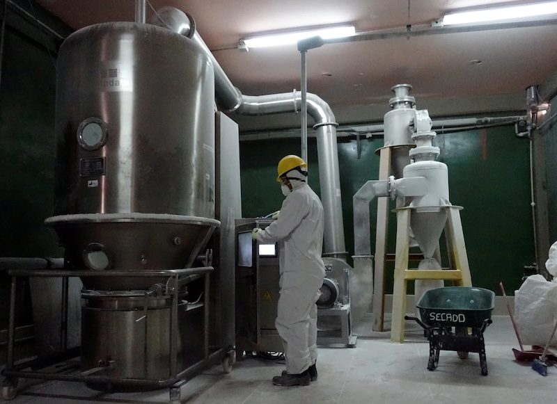 A worker handles lithium carbonate. Zhongke Electric's plant will be located in Oman's Sohar Port and Freezone