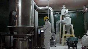 A worker handles lithium carbonate. Zhongke Electric's plant will be located in Oman's Sohar Port and Freezone