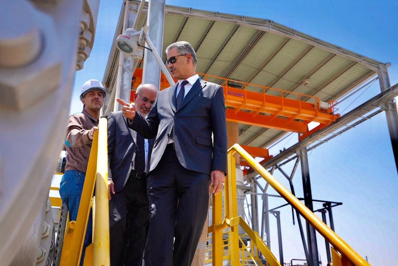 Iraqi oil minister Hayan Abdul Ghani (right) visiting an oil installation in Basra. Opec+ has accused the country of over-producing