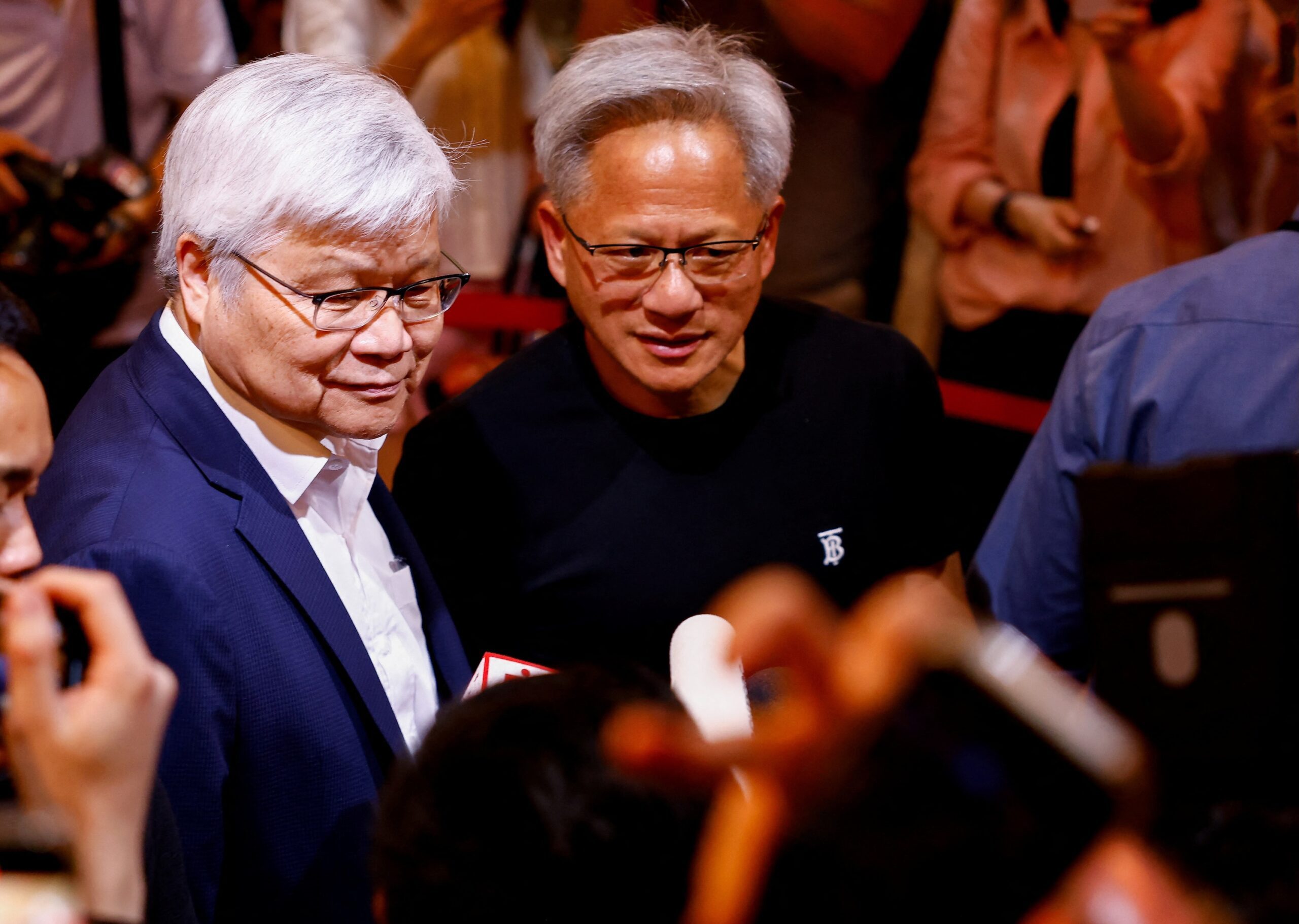 TSMC CEO C.C. Wei (left) and Nvidia CEO Jensen Huang. TSMC has held multiple talks with US envoy Steve Witkoff and Abu Dhabi's MGX