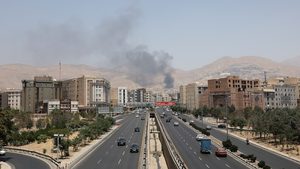 Smoke rises following what Iran says was an Israeli attack on Sharan Oil depot in Tehran on June 16, 2025