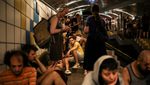 People take cover in a cable car tunnel in Haifa following a missile attack on Israel by Iran