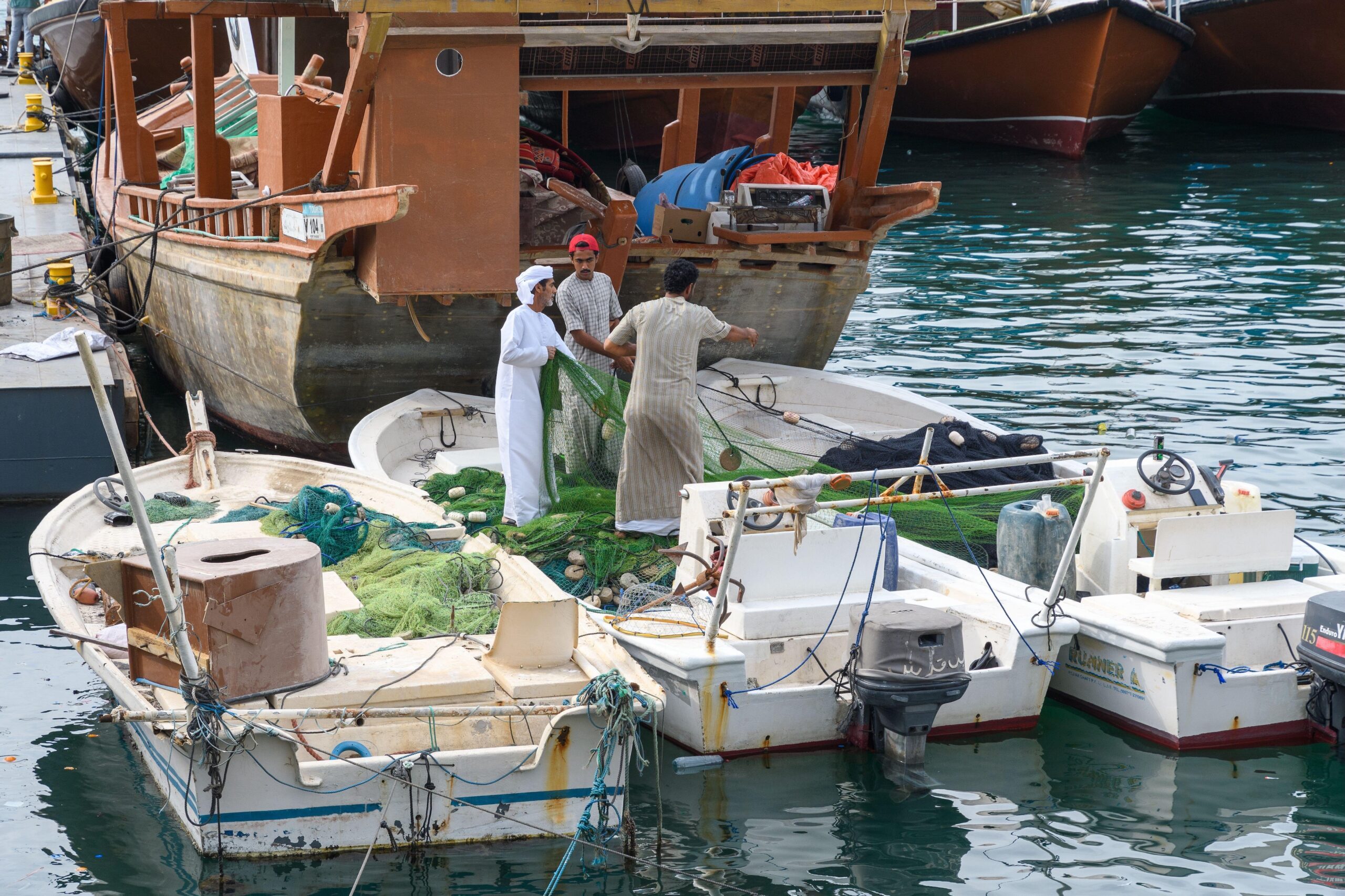 Fishermen in Khasab harbour. Due to new fishing restrictions, they say their catch has been reduced by 90%