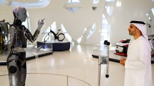 Ameca, a humanoid robot and member of the Museum of the Future staff interacts with the museum’s deputy executive director, Majed Al Mansoori in Dubai,