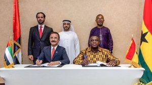PCFC chairman Sultan Ahmed bin Sulayem and Samuel Nartey George, Ghana's minister for communication, digital technology and innovation, sign the economic zone agreement