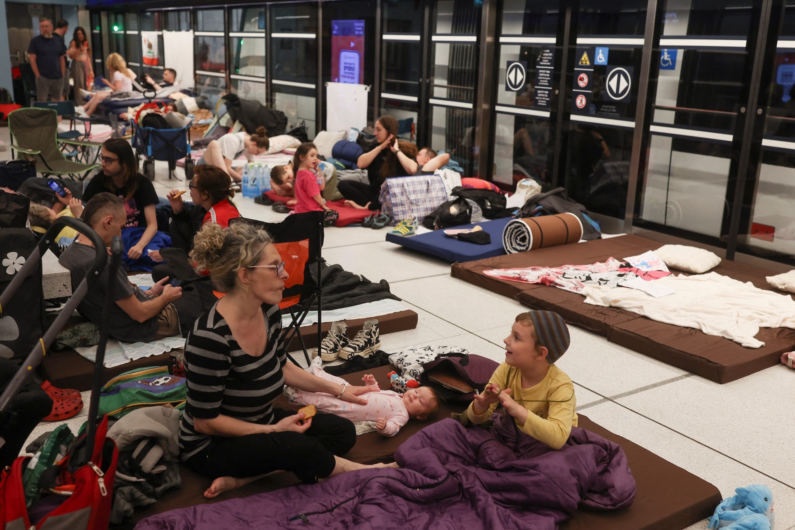 People shelter in an underground train station in Ramat Gan, Israel, on Tuesday. Gulf markets 'were more concerned about Iran’s response to an Israeli attack than the Israeli attack itself', says one analyst