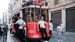 People are seen riding on a tram in Taksim. Turkish debt