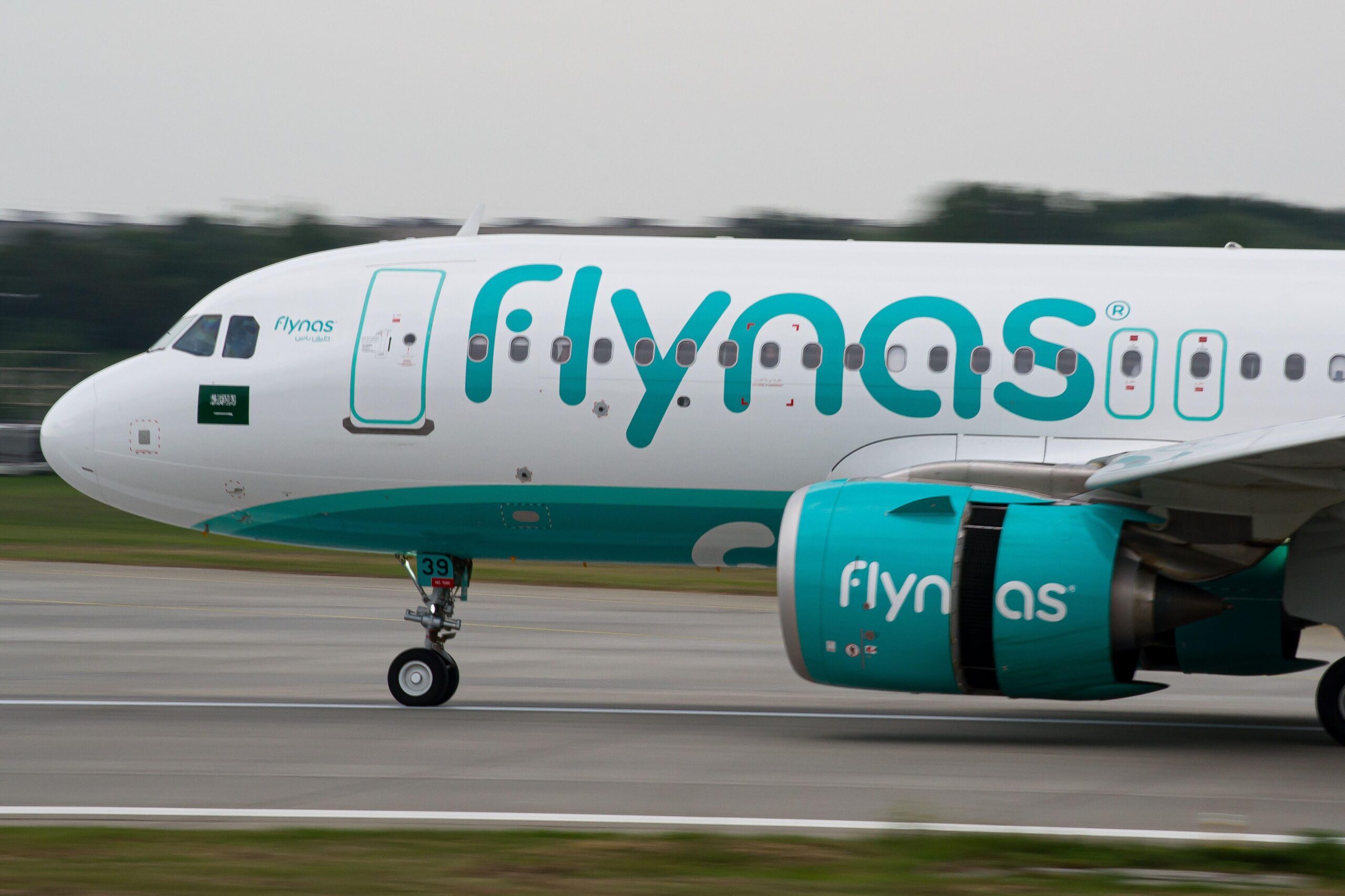 Flynas shares dipped on its first day of trading amidst a sliding Saudi Exchange and regional tensions, despite a highly anticipated IPO that raised SAR4.1 billion