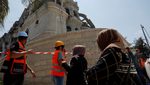 Emergency workers survey the damage after missiles fired from Iran hit a residential building, in Tamra, northern Israel. The conflict is affecting most Gulf stock markets