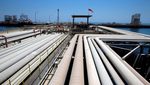 An oil tanker is loaded at Saudi Aramco's Ras Tanura oil refinery